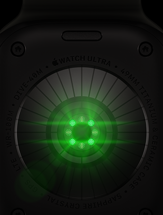 الجهة الخلفية من Apple Watch Ultra 4، إطار تيتانيوم، لون أسود، مستشعرات دائرية متعددة بأضواء LED خضراء متوهجة